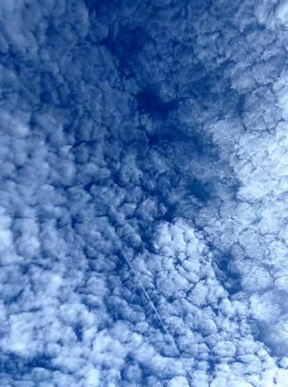 White clouds over blue sky in autumn.