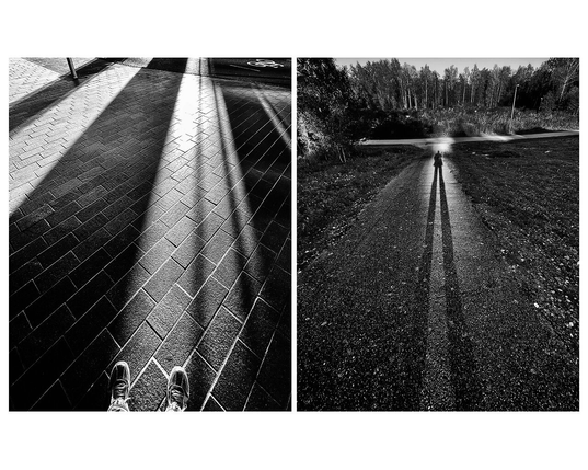 A diptych of black and white photographs. On the left photographer's shoes are visible in the lower part of the image on a brick pavement with long shadows. On the right the photographer casts a long shadow along a paved path in park surroundings.